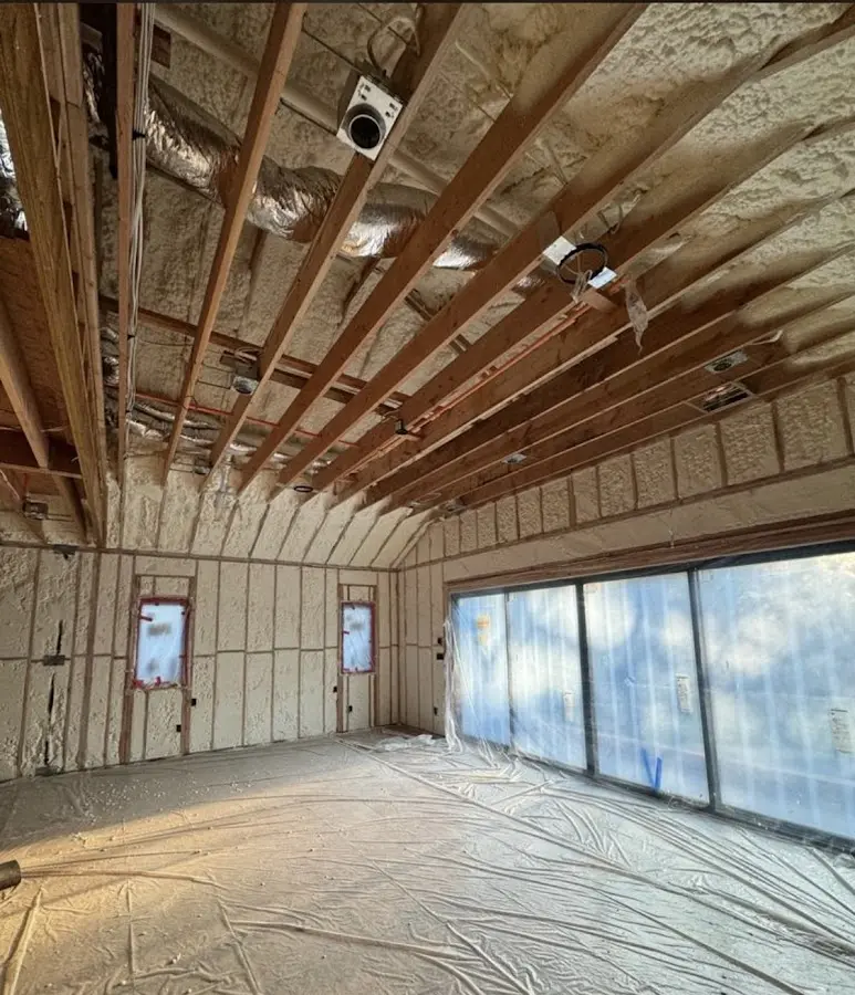Interior walls and ceiling insulated with spray foam during new construction in Highland Park